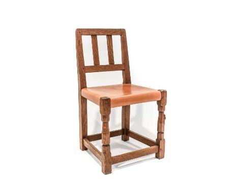 Robert Mouseman Thompson (1876-1955): An English Oak Slat Back Chair, 1936, slung hide seat, on octagonal front legs with a r