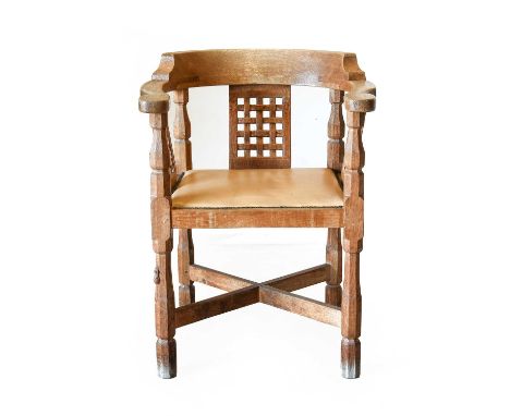 Workshop of Robert Mouseman Thompson (Kilburn): An English Oak Monk's Chair, with curved back and shaped arms, over three lat