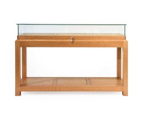 A Modern Bespoke Oak Display Cabinet, made by MJ Cabinetmakers (Keswick) the top section with glass top and sides with a slid