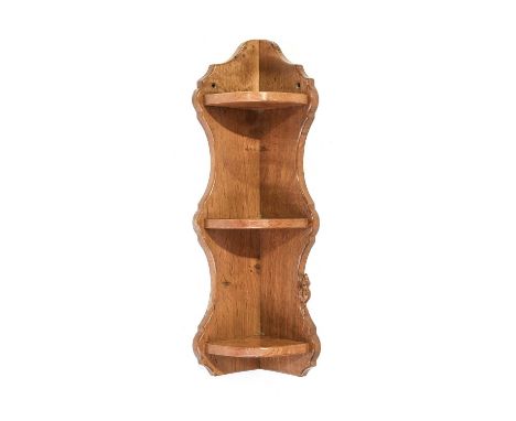 Beaverman: Colin Almack (1930-1996) (Sutton-under-Whitestonecliffe): An Oak Three Tier Corner Shelf, with shaped sides, with 