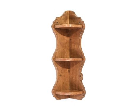 Beaverman: Colin Almack (1930-1996) (Sutton-under-Whitestonecliffe): An Oak Three Tier Corner Shelf, with shaped sides, with 