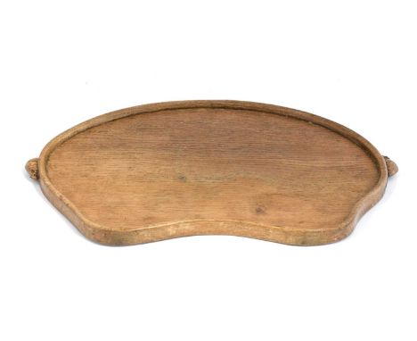 Workshop of Robert Mouseman Thompson (Kilburn): An English Oak Kidney Tea Tray, with carved mouse trademark handles, 47cm wid