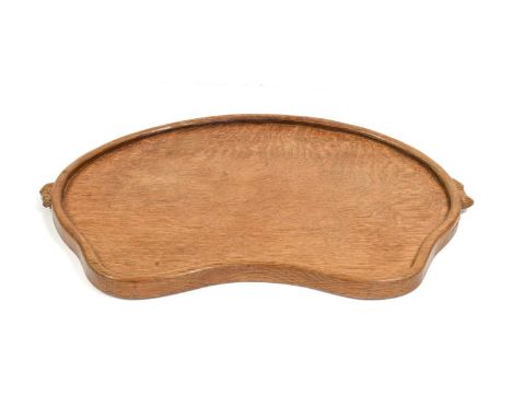 Workshop of Robert Mouseman Thompson (Kilburn): An English Oak Kidney Tea Tray, with carved mouse trademark handles, 47cm wid