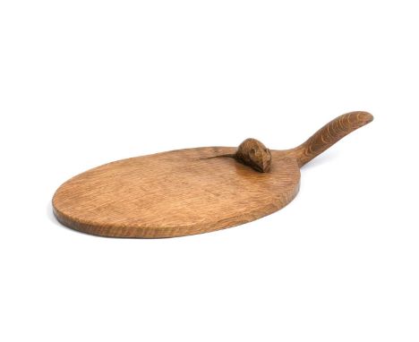 Robert Mouseman Thompson (1876-1955): An English Oak Cheese Board, of standard form, with carved mouse trademark on the board