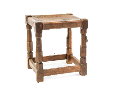 Robert Mouseman Thompson (1876-1955): An English Oak Dressing Table Stool, circa 1930/40s, solid leather seat, on four octago