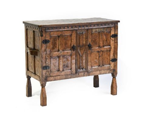 Gnomeman: Thomas Whittaker (1912-1991) (Littlebeck): An English Oak Panelled Cupboard, the adzed rectangular top, two cupboar
