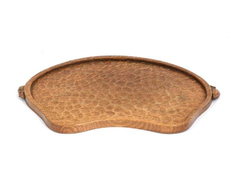 Workshop of Robert Mouseman Thompson (Kilburn): An English Oak Kidney Tea Tray, with carved mouse trademark handles, 48cm wid