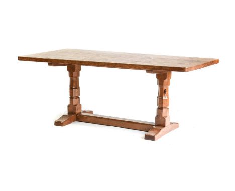 Robert Mouseman Thompson (1876-1955): An English Oak 6ft Refectory Dining Table, circa 1950s, the adzed dowelled top, on two 