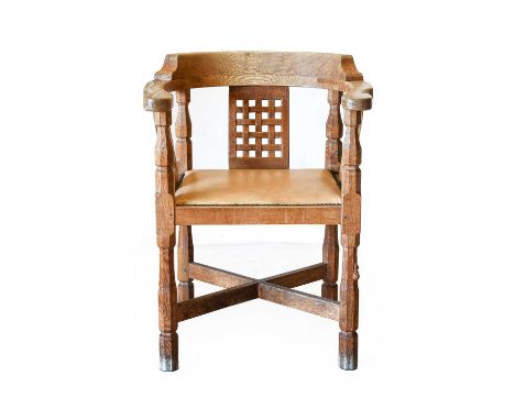 Workshop of Robert Mouseman Thompson (Kilburn): An English Oak Monk's Chair, with curved back and shaped arms, over three lat