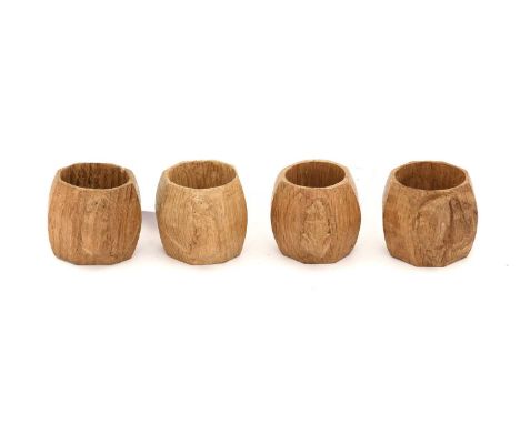 Workshop of Robert Mouseman Thompson (Kilburn): Four English Oak Napkin Rings, of standard octagonal form, each with carved m