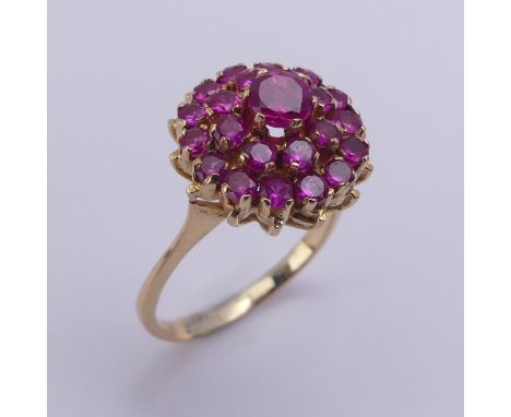 A ruby cluster Ring, the circular synthetic pink stones claw set in unmarked yellow metal, tested as 18ct gold, 14mm cluster 