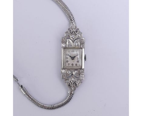 An Art Deco lady's diamond Cocktail Watch, unsigned square dial with Swiss 16-jewels movement, with diamond set mount above a