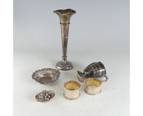 A quantity of damaged Silver, including two napkin rings, a spill vase with weighted base etc., weighable 4.2ozt, together wi
