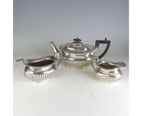 A late Victorian silver three piece Tea Set, by&nbsp;Charles Boyton (II), hallmarked London 1897, of ovoid form with demi-flu