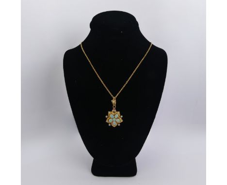 An antique opal Pendant, the five oval opals and one small circular forming the central flowerhead cluster, with seed pearls 