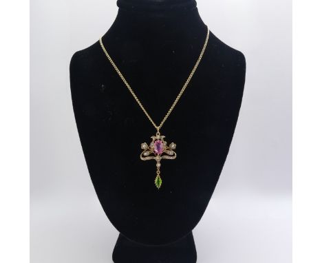 An Edwardian 9ct gold Pendant, in the Art Nouveau style with 'Suffragette' colours set seed pearls, pink and green pastes, 3.