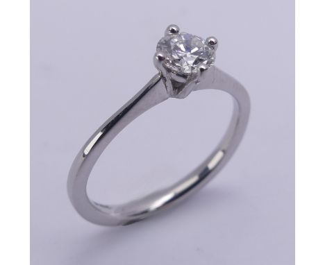 A single stone diamond Ring, the modern brilliant cut stone approx. 0.42ct, mounted in platinum, Size K, 3.1g, with accompany