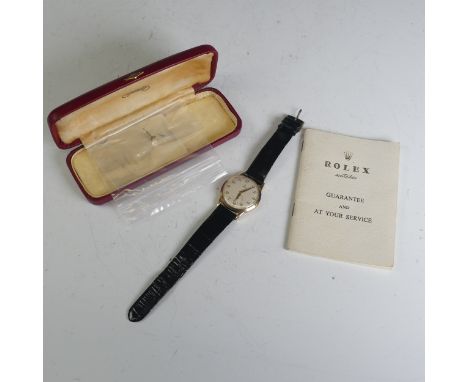 A vintage 9ct gold Tudor Wristwatch, the signed silvered dial with gilt Arabic numerals and hands and with subsidiary seconds