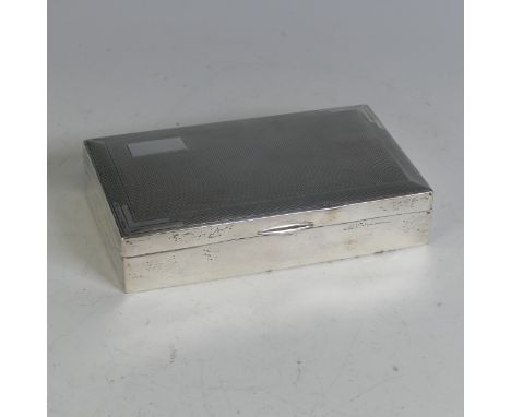 A George VI silver Cigarette Box, by&nbsp;Sanders &amp; Mackenzie, hallmarked Birmingham 1934, of rectangular form with engin