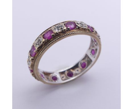A ruby and diamond full Eternity Ring,&nbsp;mounted in 9ct yellow and white gold, 4.75mm wide, Size N, approx. total weight 2