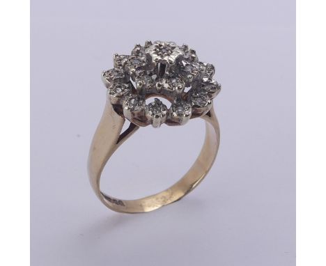 A diamond cluster Ring, illusion set in 9ct yellow and white gold, Size N½, 4.1g. 