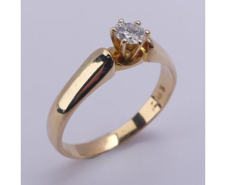 A single stone diamond Ring, the brilliant cut stone approx. 0.25ct, six claw set in 18ct yellow gold, Size P, 3.5g. 