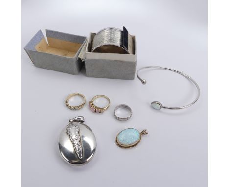 A 9ct yellow gold mounted opal Pendant,&nbsp;the oval opal collet set in ropetwist mount, 2.2cm exc. bale, together with thre