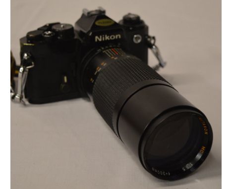 Nikon FE SLR Camera in black, with Mitakon MC 1:55 f=300mm zoom lens