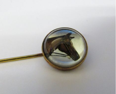 Tested as 15ct gold reverse crystal intaglio stick pin of a horse