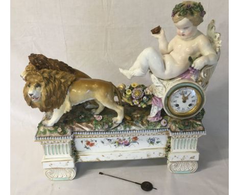 Large Meissen style 19th century figural clock depicting a putto in a chariot drawn by 2 lions (cross swords mark to undersid