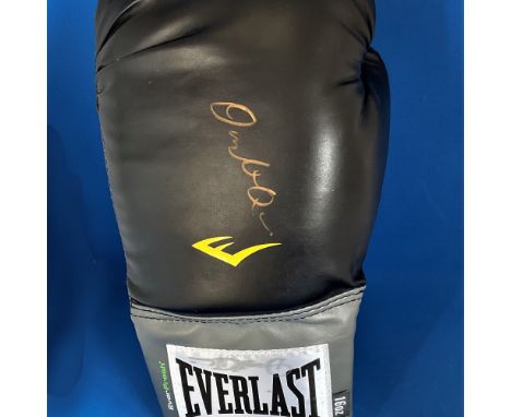 Boxing Dwight Muhammad QAWI signed 14OZ Black Everlast Glove. Dwight Muhammad Qawi (born Dwight Braxton; January 5, 1953) is 