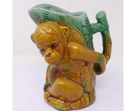 Majolica monkey jug, H: 20 cm, overglazed fleabites to rim. P&amp;P Group 2 (£18+VAT for the first lot and £3+VAT for subsequ