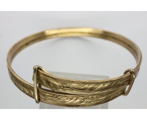 Victorian yellow metal infant bangle with chased decoration. P&amp;P Group 1 (£14+VAT for the first lot and £1+VAT for subseq