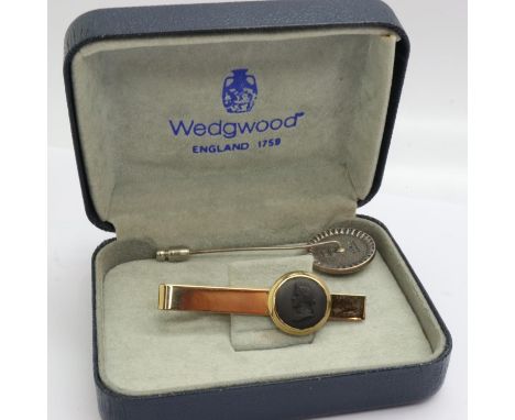 Boxed Wedgwood black Jasperware brooch and tie pin, largest L: 70 mm. P&amp;P Group 1 (£14+VAT for the first lot and £1+VAT f