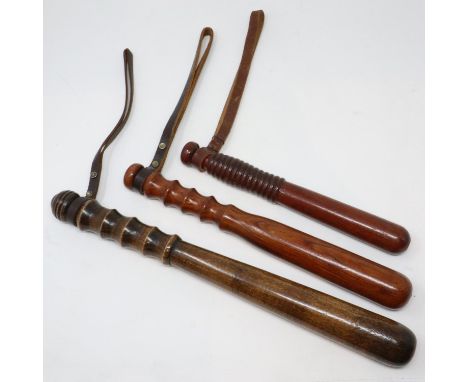 Three turned wooden truncheons with leather wrist straps. P&amp;P Group 1 (£14+VAT for the first lot and £1+VAT for subsequen