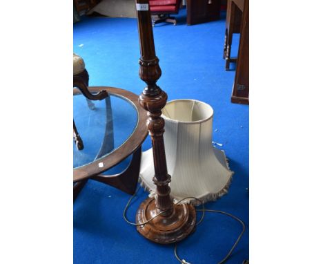 A traditional standard lamp having classical style column
