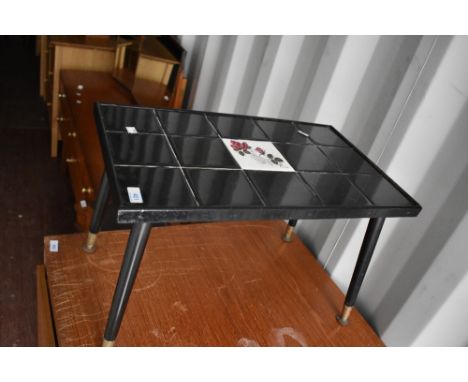 A vintage tile top coffee table on dansette style splay legs, small proportions approx W56 D34 H36cm