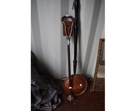 A shooting stick and copper bed warmer
