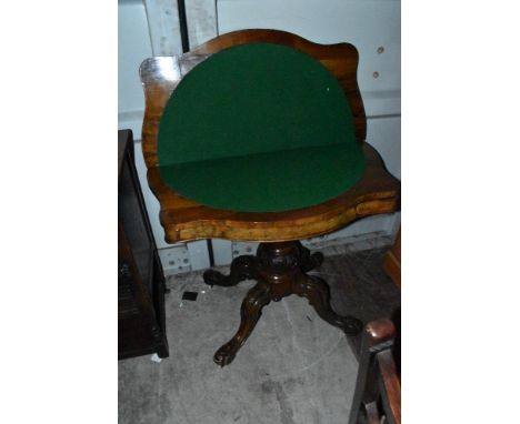 A 19th Century walnut and mahogany fold over card table having shaped top, column base and quadruple leg