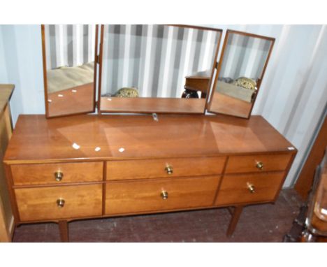 A vintage teak and laminate dressing table, having triple mirror over three shallow and three deep drawers, width approx. 150