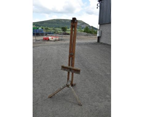 A traditional artist easel of large proportions