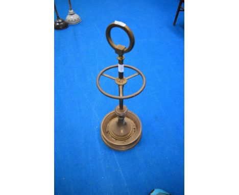 A vintage brass stick stand