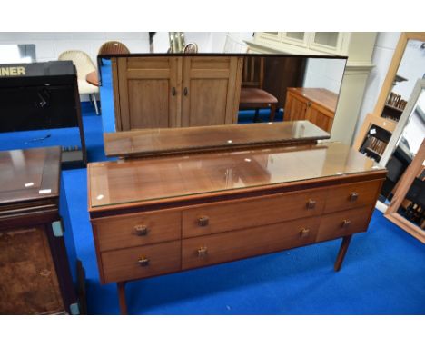 A vintage teak effect dressing table
