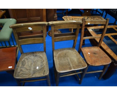 A pair of vintage chapel chairs and a similar solid seat railback chair