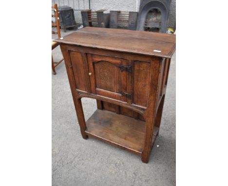 A period oak side or hall cabinet with single cupboard over pot shelf, width approx 75cm, height 95cm