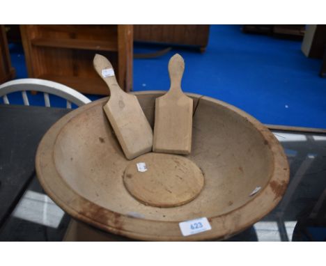 An antique sycamore butter bowl, diameter 40cm, with some damage and a pair of similar butter pats/scotch hands, originally b