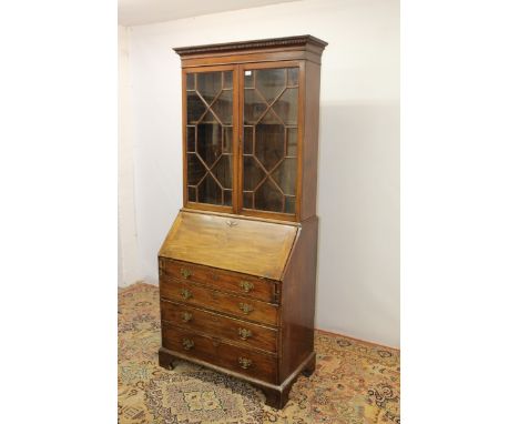 George III mahogany bureau bookcase with shelves above enclosed by two astragal glazed doors, fitted interior and four long g