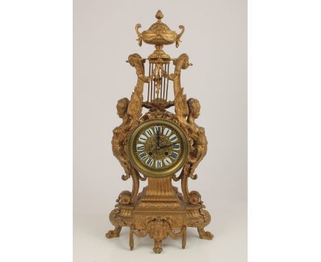 Early 20th century French gilt metal Louis XVI revival mantel clock with circular dial and enamelled Roman numerals, French e