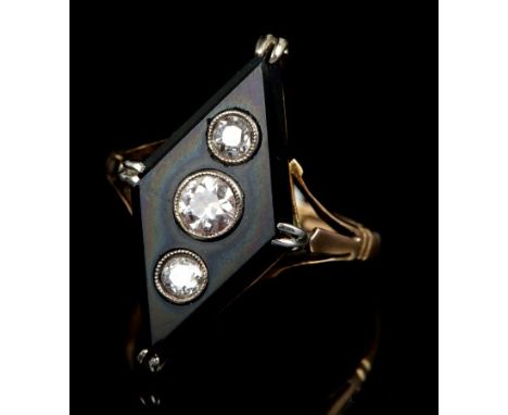 Art Deco diamond and onyx ring, the diamond-shape black onyx panel inset with three old cut diamonds in millegrain setting wi