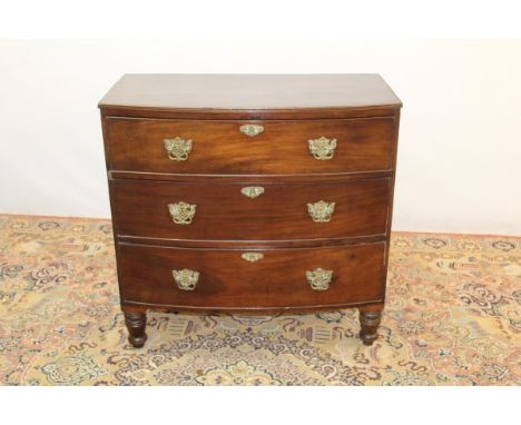 George IV mahogany bow front chest of three long graduated drawers, on turned feet, 90cm high x 92cm wide x 47cm deep